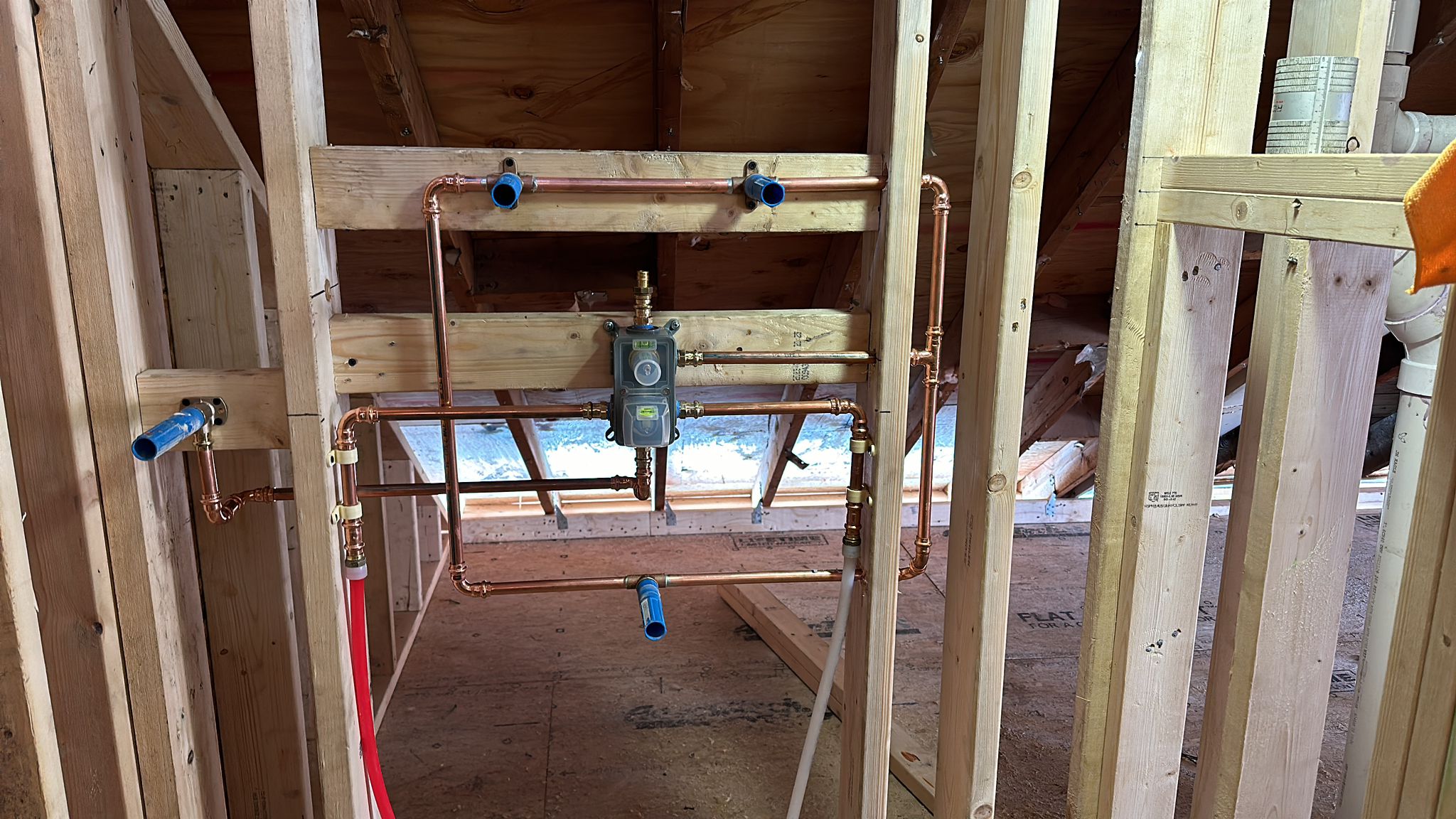 Copper water line rough-in with PEX manifold in a framed wall, Greater Boston, MA